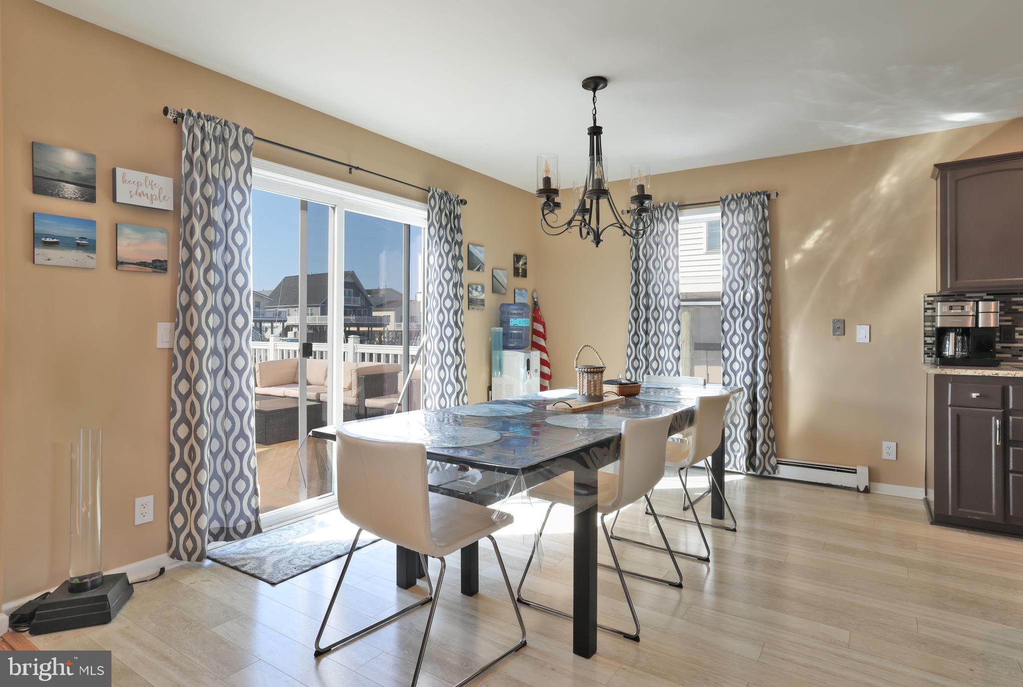 348 Kingfisher Road Tuckerton, NJ 08087 - Photo 11 of 37 a view of a dining room with furniture window and wooden floor