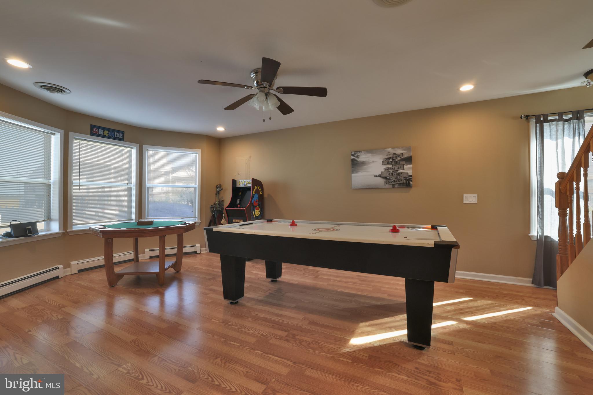348 Kingfisher Road Tuckerton, NJ 08087 - Photo 12 of 37 a view of a workspace with furniture window and wooden floor