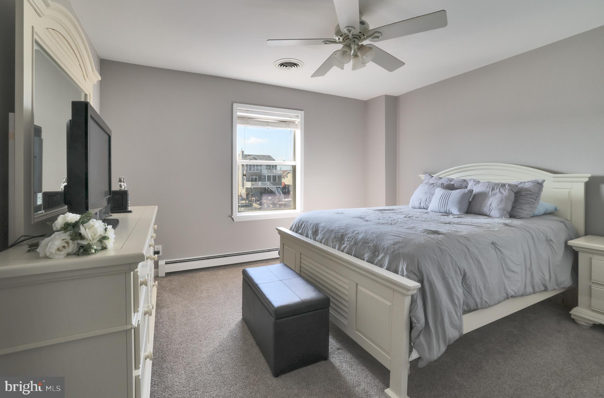 348 Kingfisher Road Tuckerton, NJ 08087 - Photo 15 of 37 a bedroom with a bed and a window