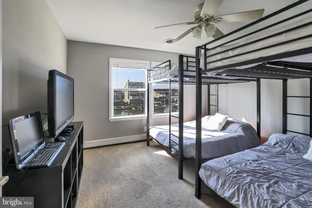 a bedroom with bed and a window