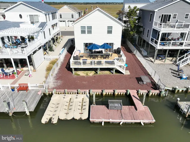 an aerial view of a house with swimming pool view