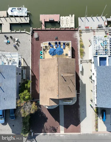 an aerial view of a house with a swimming pool