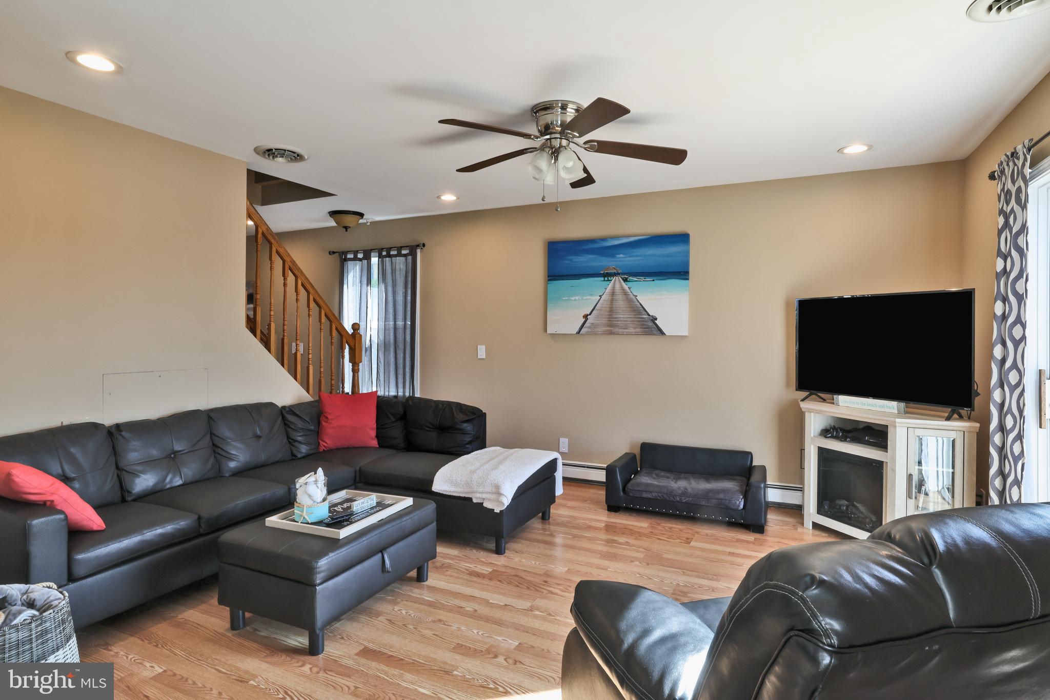 348 Kingfisher Road Tuckerton, NJ 08087 - Photo 7 of 37 a living room with furniture and a flat screen tv