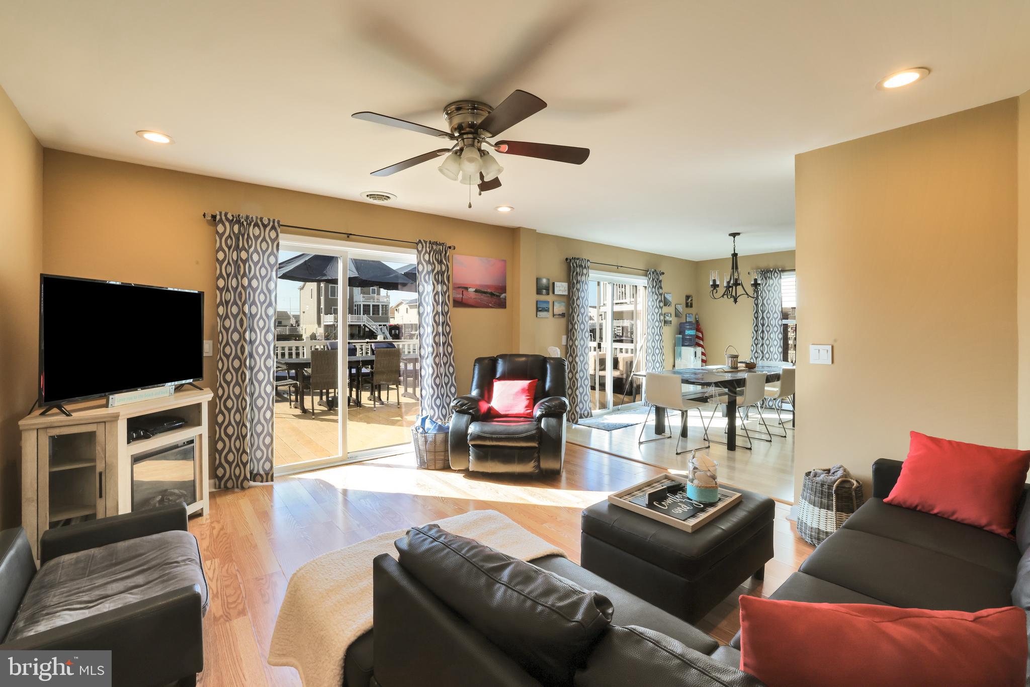 348 Kingfisher Road Tuckerton, NJ 08087 - Photo 9 of 37 a living room with furniture and a flat screen tv