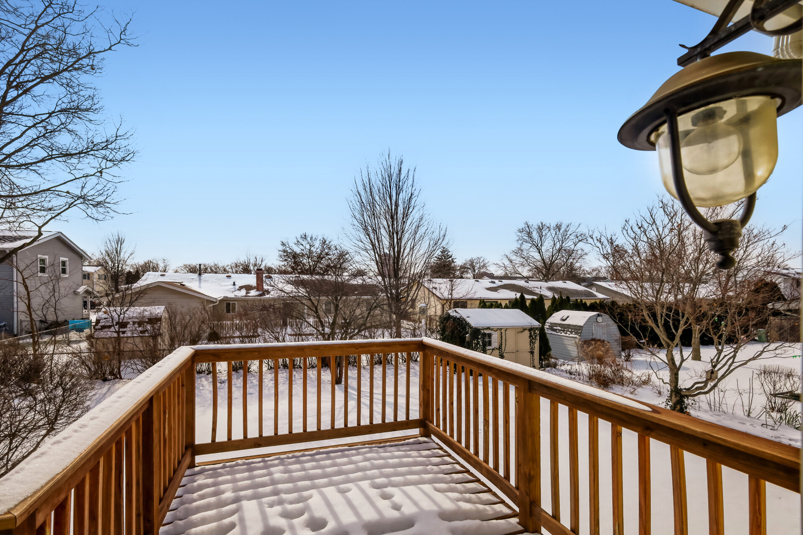 295 Brighton Road Elk Grove Village, IL 60007 - Photo 23 of 26 a view of a balcony with wooden fence and floor