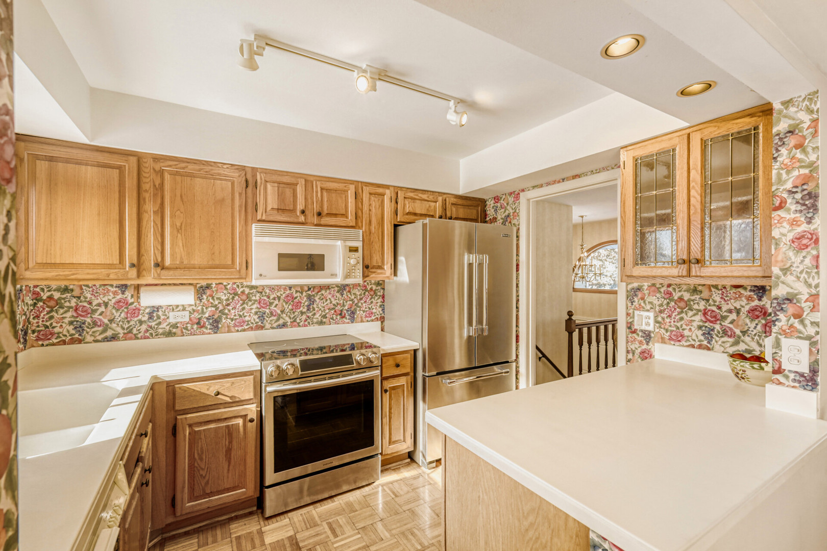 295 Brighton Road Elk Grove Village, IL 60007 - Photo 7 of 26 a kitchen with a stove a sink and a refrigerator