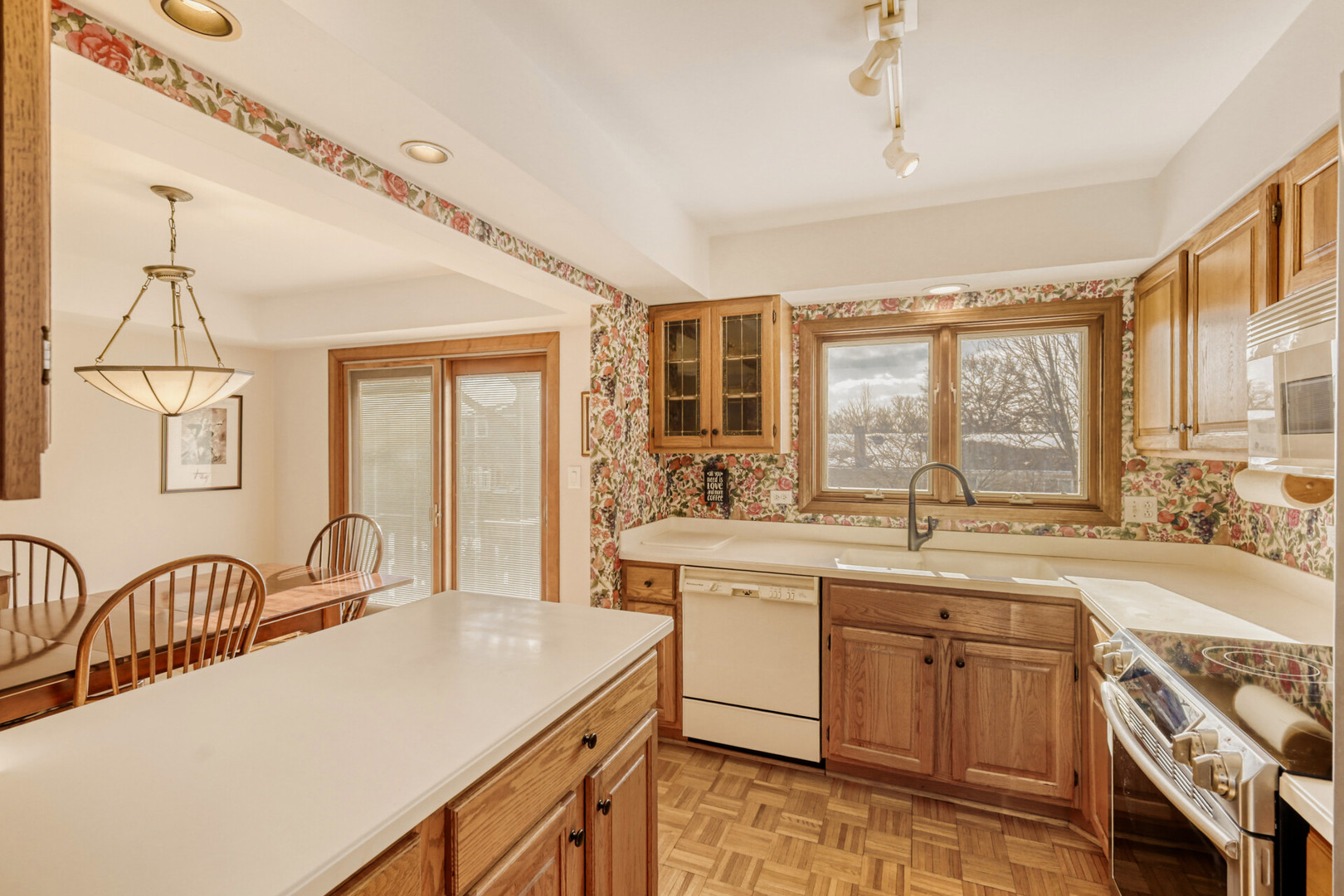 295 Brighton Road Elk Grove Village, IL 60007 - Photo 9 of 26 a kitchen with a sink stove and cabinets