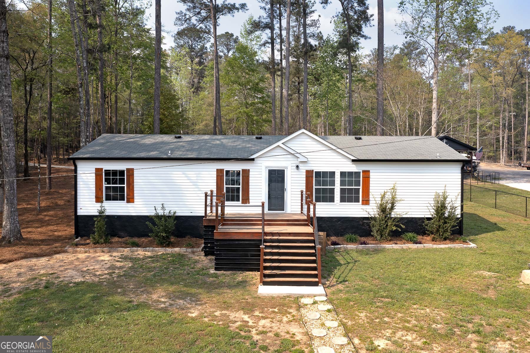 595 Barnetts Bridge Road Jackson, GA 30233 - Photo 39 of 47 a front view of a house with a yard