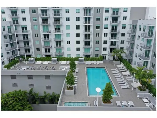 a view of a building with a garden