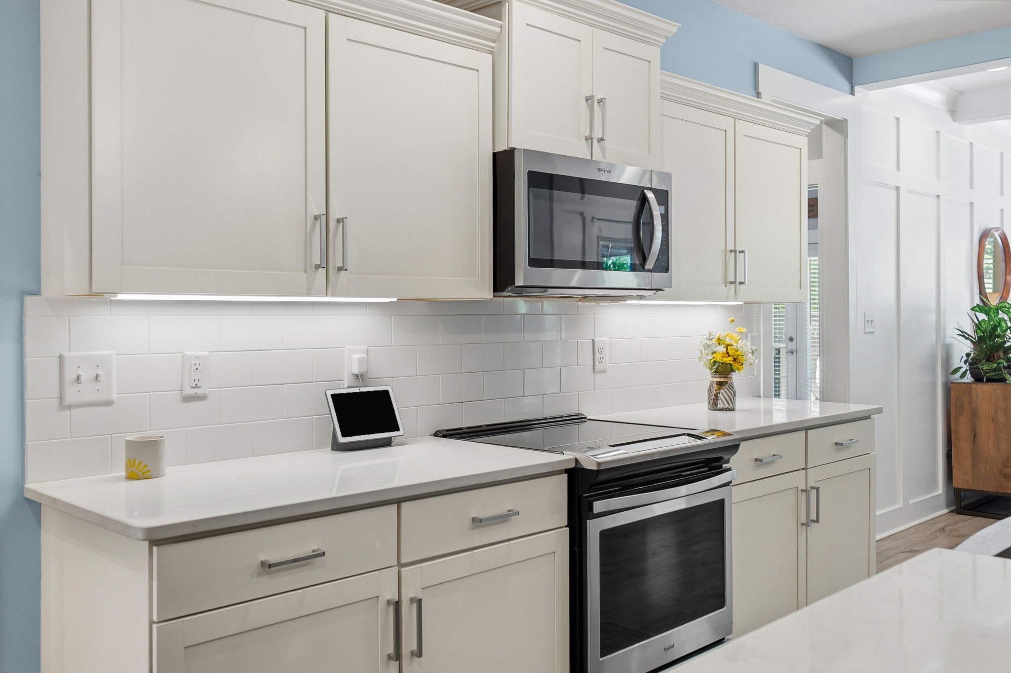 4334 Memory Lane Adams, TN 37010 - Photo 16 of 63 a kitchen with white cabinets and stainless steel appliances