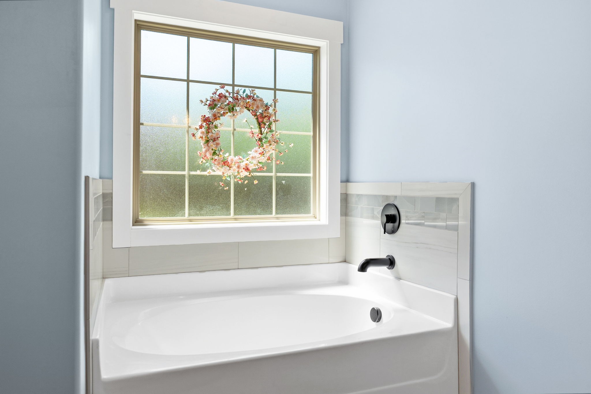 4334 Memory Lane Adams, TN 37010 - Photo 27 of 63 a bathroom with a bathtub and a window