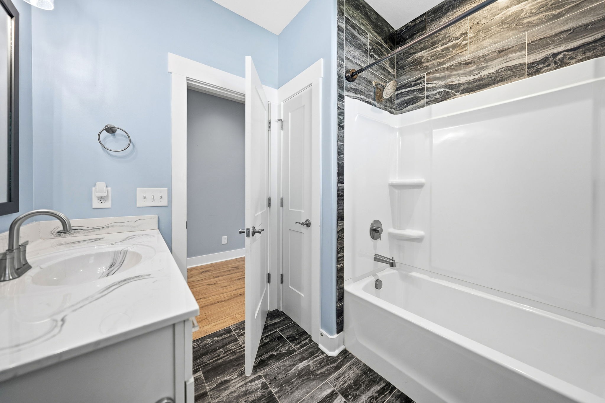 4334 Memory Lane Adams, TN 37010 - Photo 37 of 63 a bathroom with a tub sink vanity granite and shower