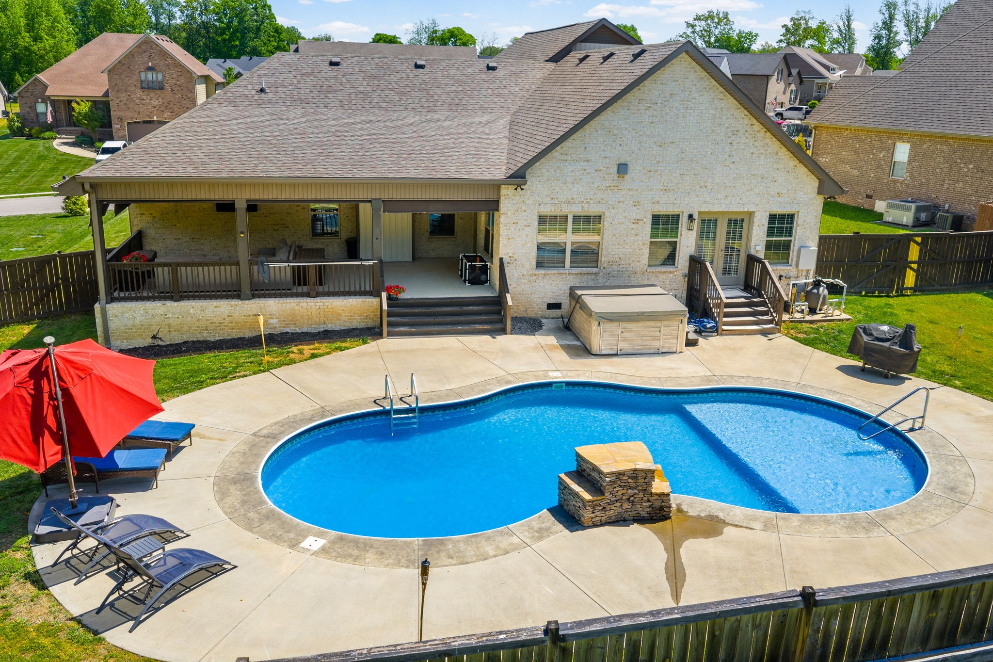 4334 Memory Lane Adams, TN 37010 - Photo 60 of 63 a view of a house with swimming pool and furniture