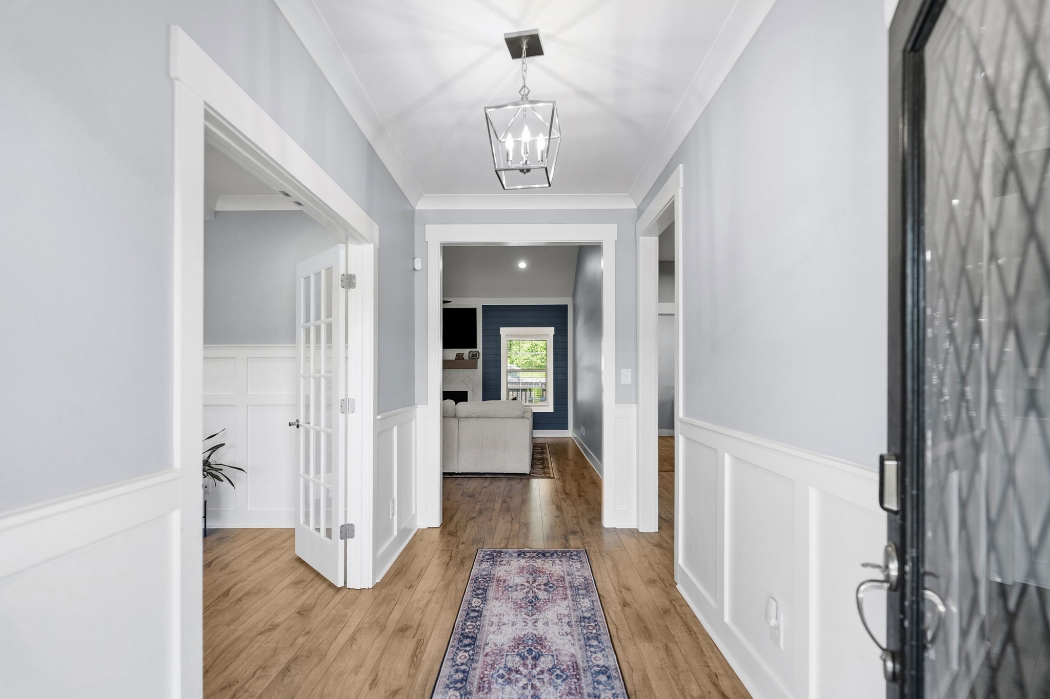 4334 Memory Lane Adams, TN 37010 - Photo 6 of 63 a view of a hallway view with wooden floor and staircase