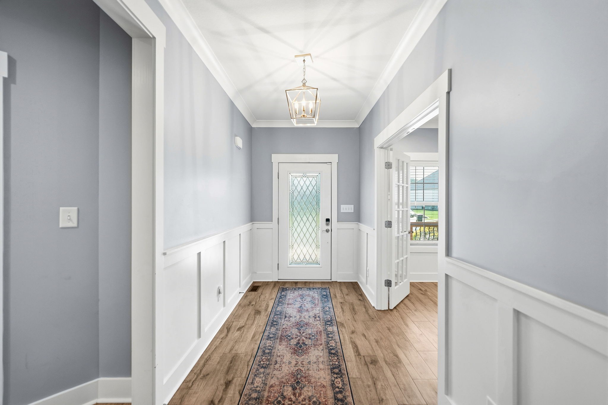 4334 Memory Lane Adams, TN 37010 - Photo 7 of 63 a view of a hallway view with wooden floor and staircase