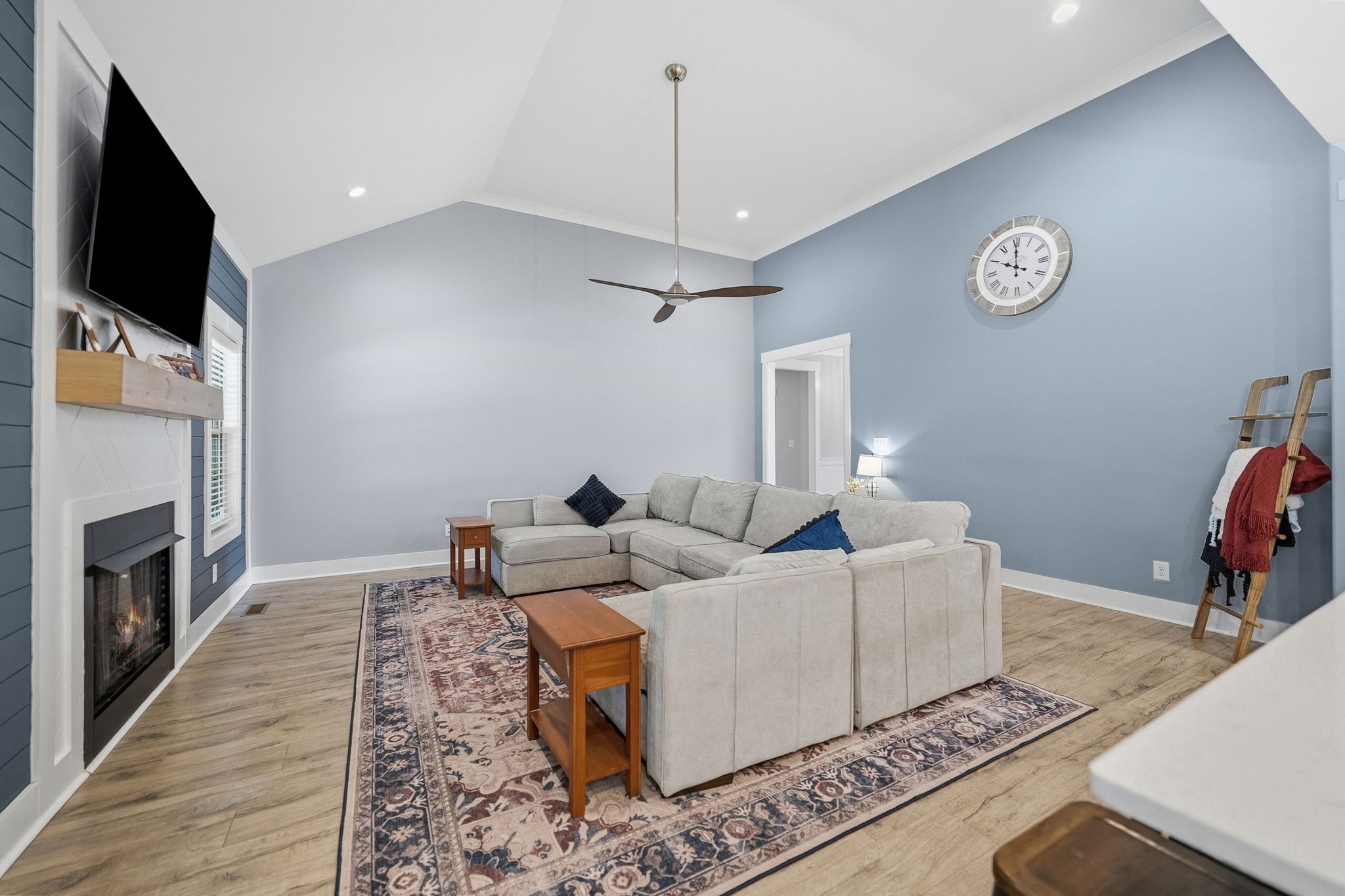 4334 Memory Lane Adams, TN 37010 - Photo 10 of 63 a living room with furniture a flat screen tv and a fireplace