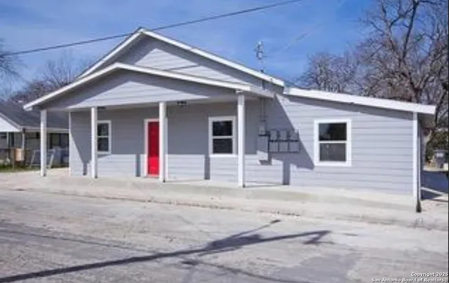 a house with trees in the background