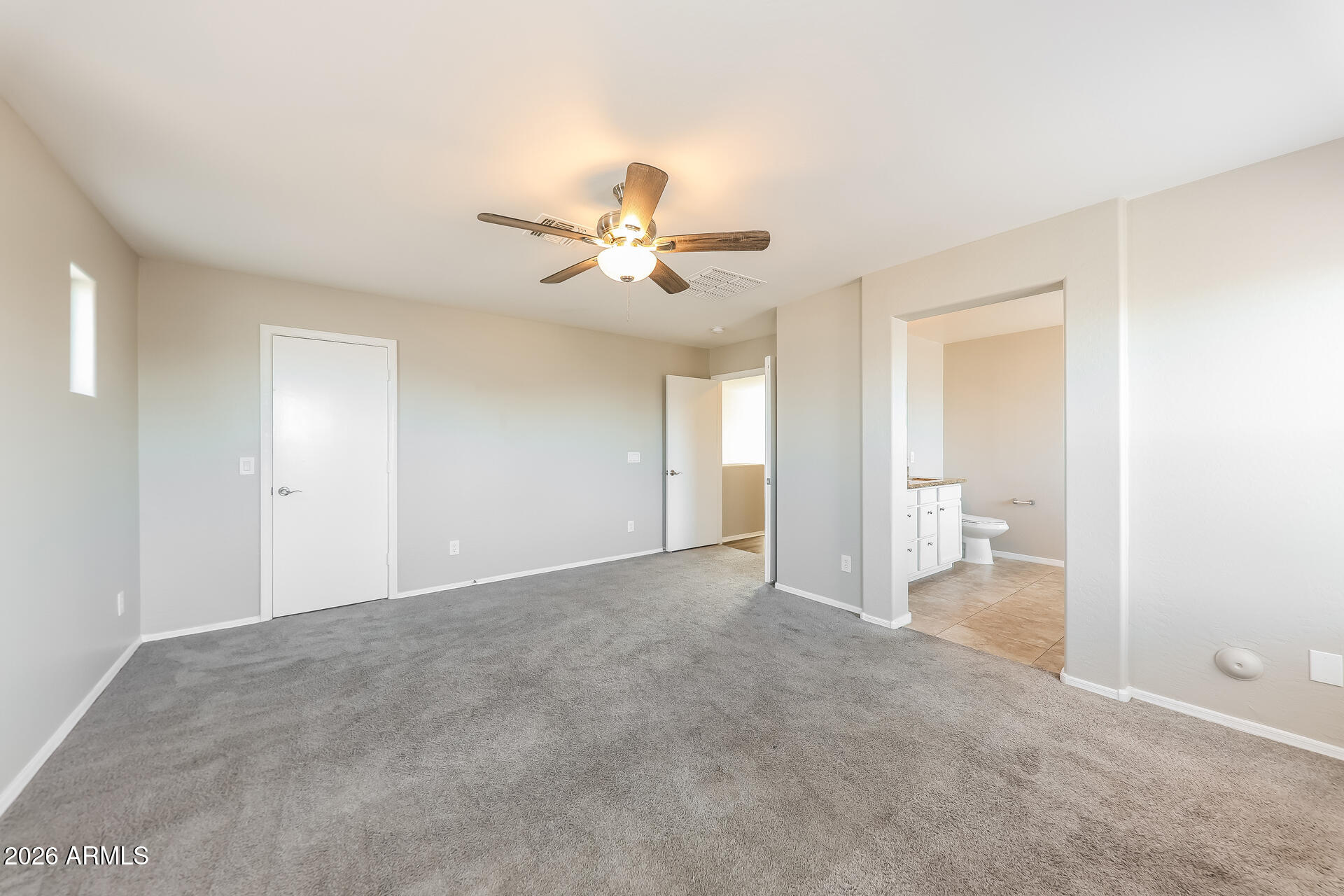 6716 South 36th Lane Phoenix, AZ 85041 - Photo 11 of 22 a view of a big room with chandelier fan and windows