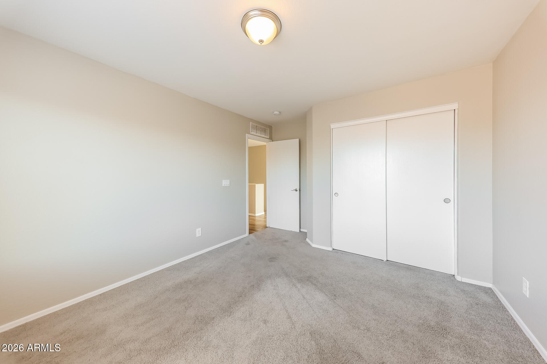 6716 South 36th Lane Phoenix, AZ 85041 - Photo 13 of 22 a view of an empty room