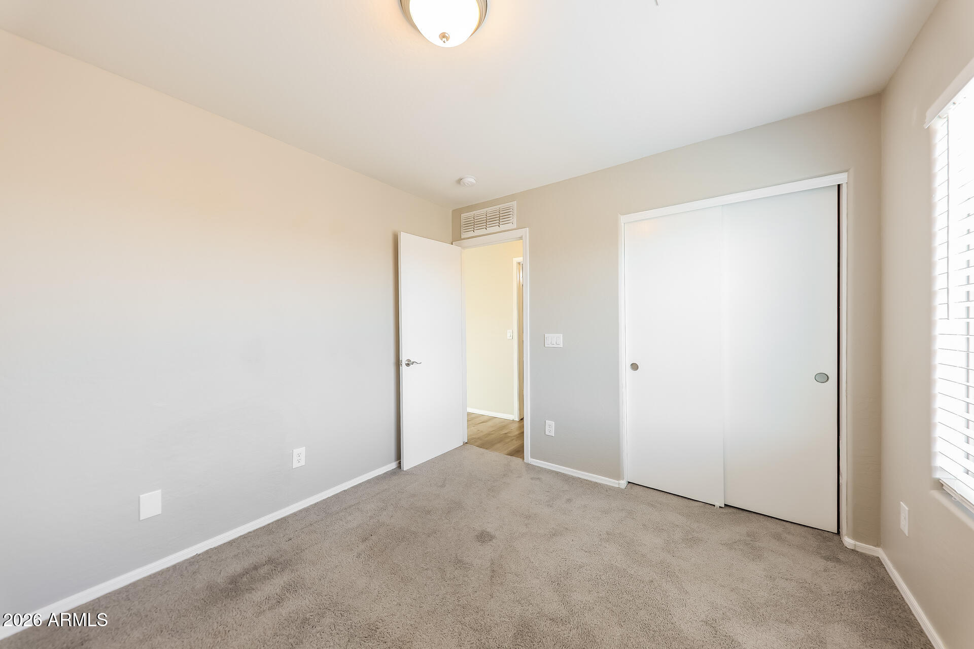 6716 South 36th Lane Phoenix, AZ 85041 - Photo 15 of 22 a view of an empty room