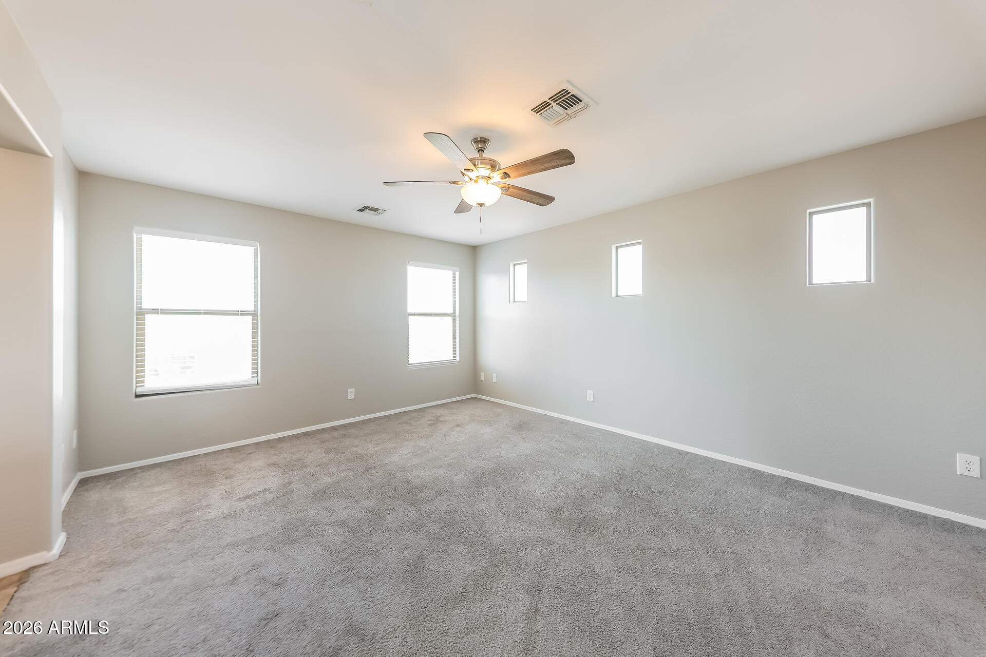 6716 South 36th Lane Phoenix, AZ 85041 - Photo 10 of 22 a view of an empty room with a window