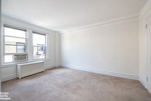 a bedroom with a large bed and a couch