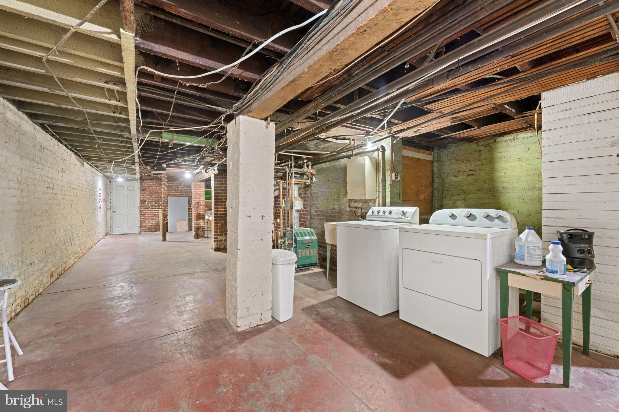 2707 11th Street Northwest Washington, DC 20001 - Photo 19 of 49 a view of a storage room with washer and dryer