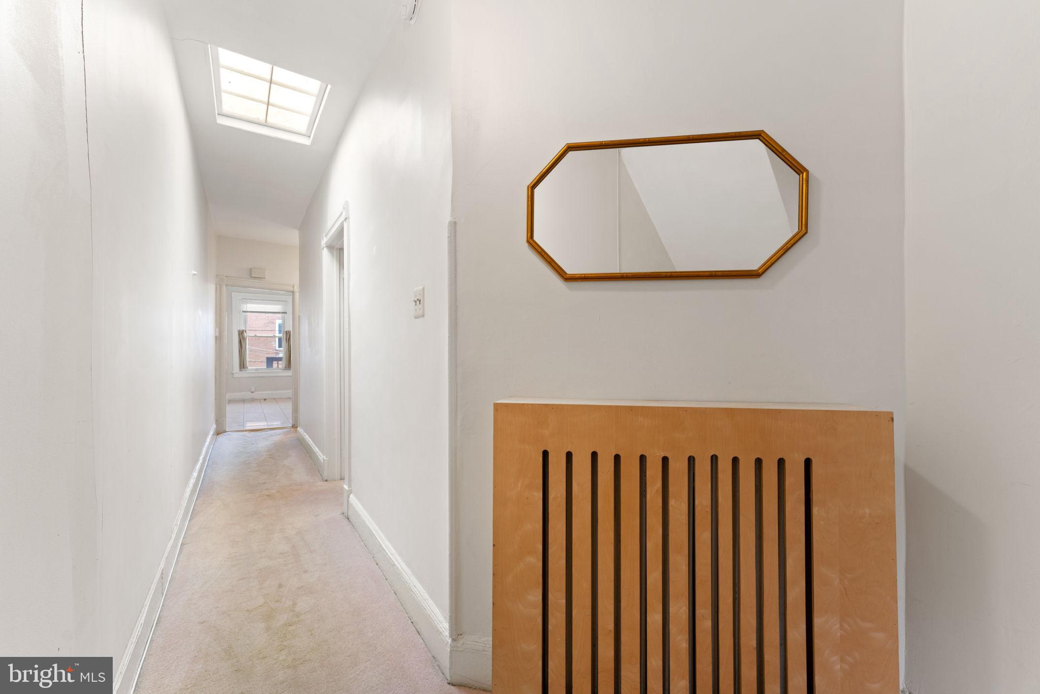 2707 11th Street Northwest Washington, DC 20001 - Photo 27 of 49 an entryway with wooden floor and mirror