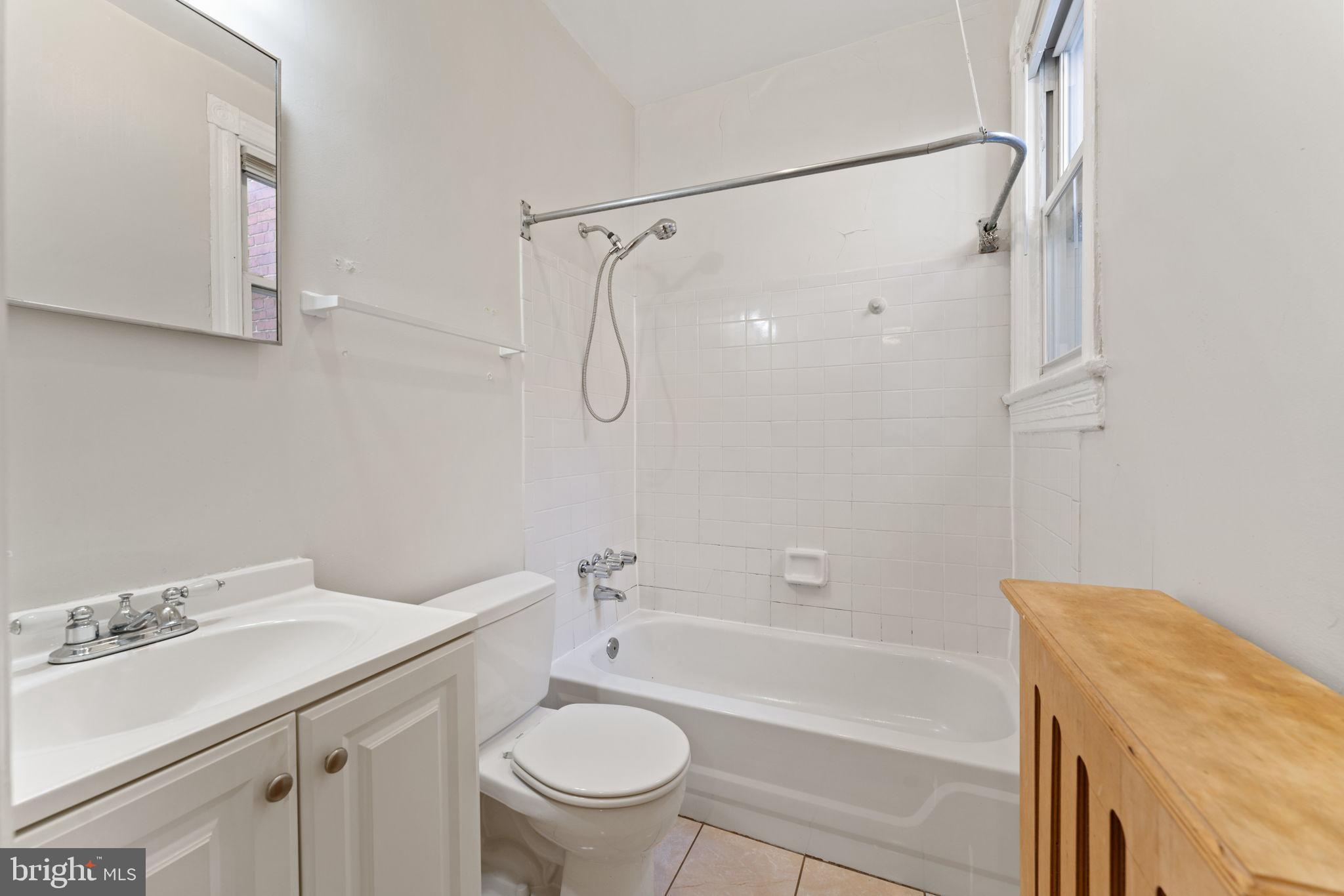 2707 11th Street Northwest Washington, DC 20001 - Photo 34 of 49 a bathroom with a sink toilet and shower