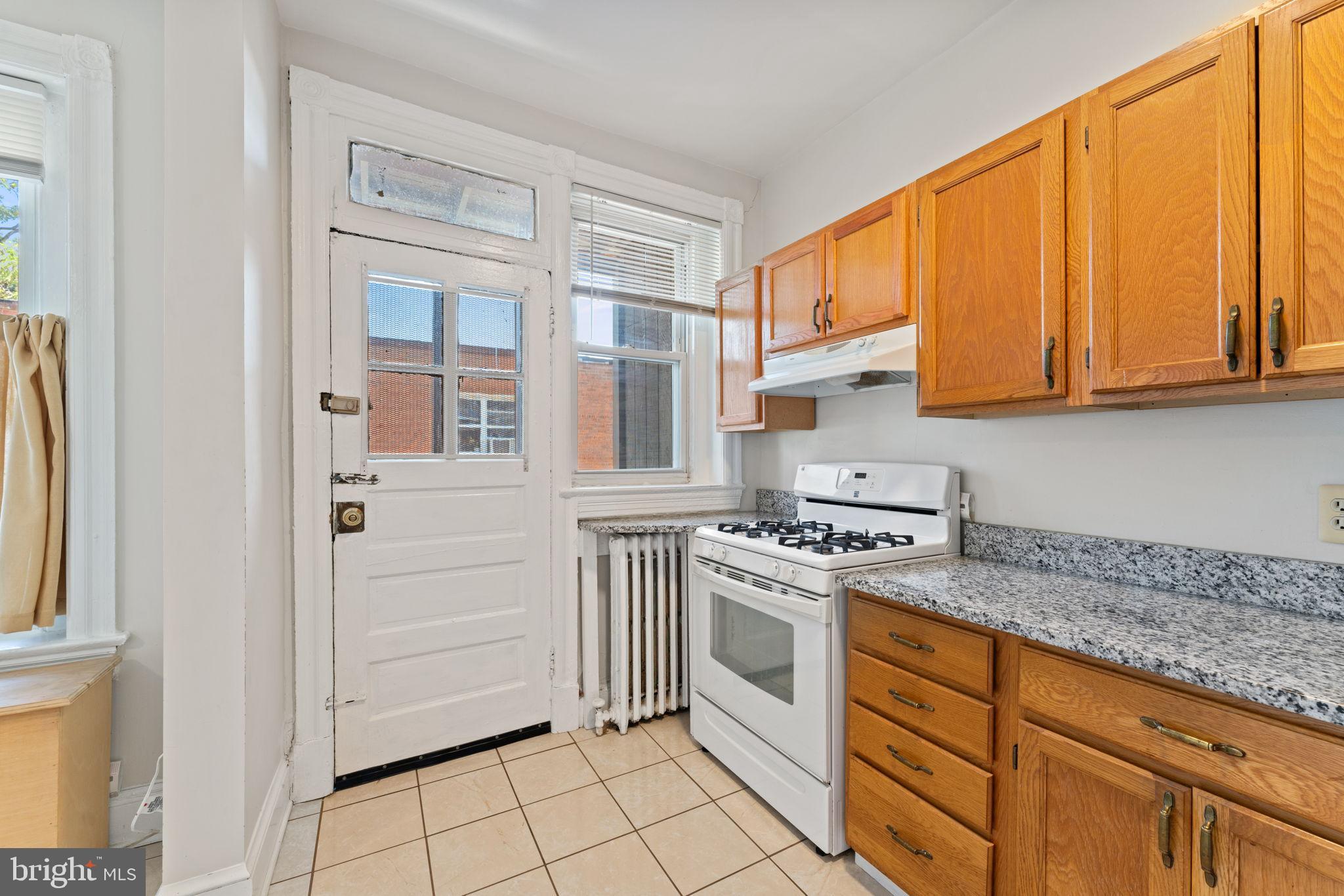2707 11th Street Northwest Washington, DC 20001 - Photo 38 of 49 a kitchen with white cabinets and white appliances