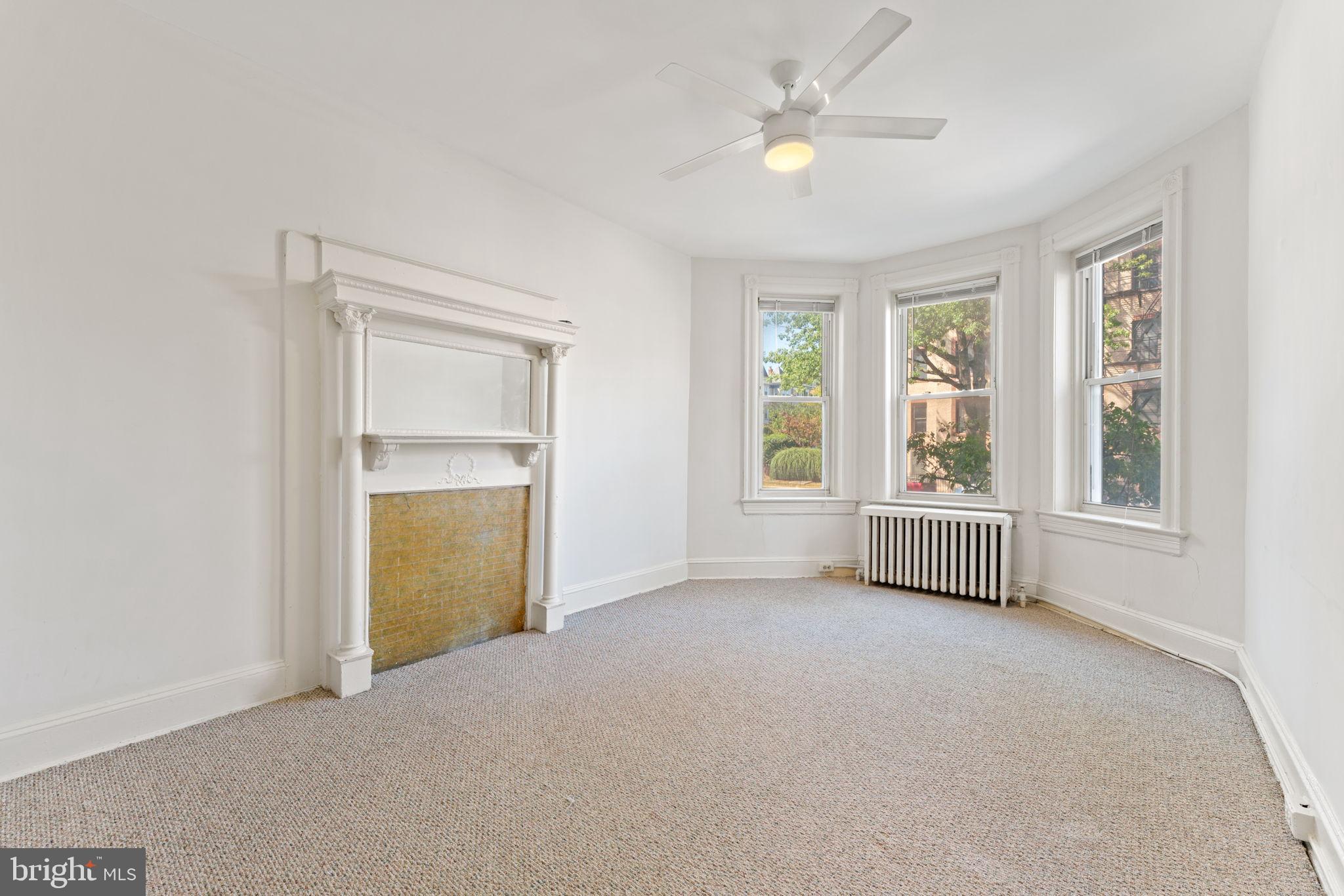 2707 11th Street Northwest Washington, DC 20001 - Photo 4 of 49 an empty room with windows and closet