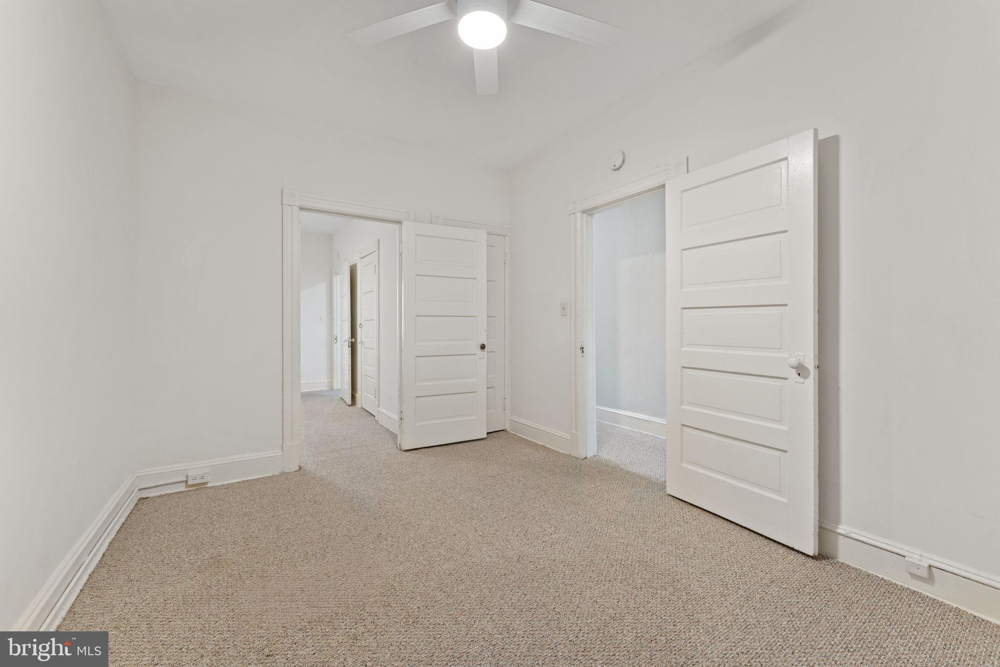 2707 11th Street Northwest Washington, DC 20001 - Photo 8 of 49 an empty room with a ceiling fan