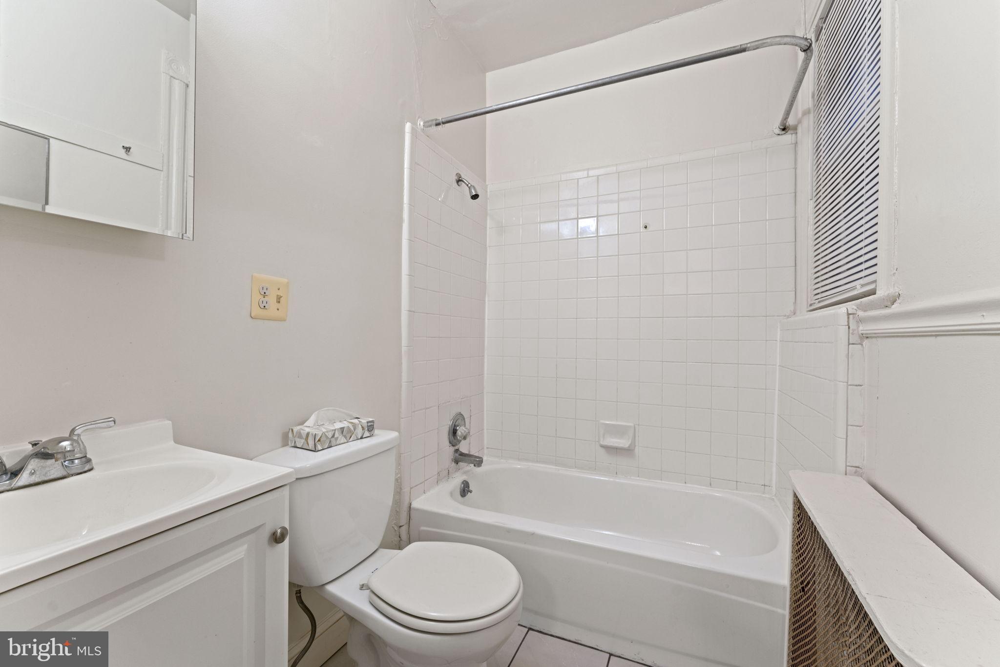 2707 11th Street Northwest Washington, DC 20001 - Photo 10 of 49 a bathroom with a sink toilet and shower