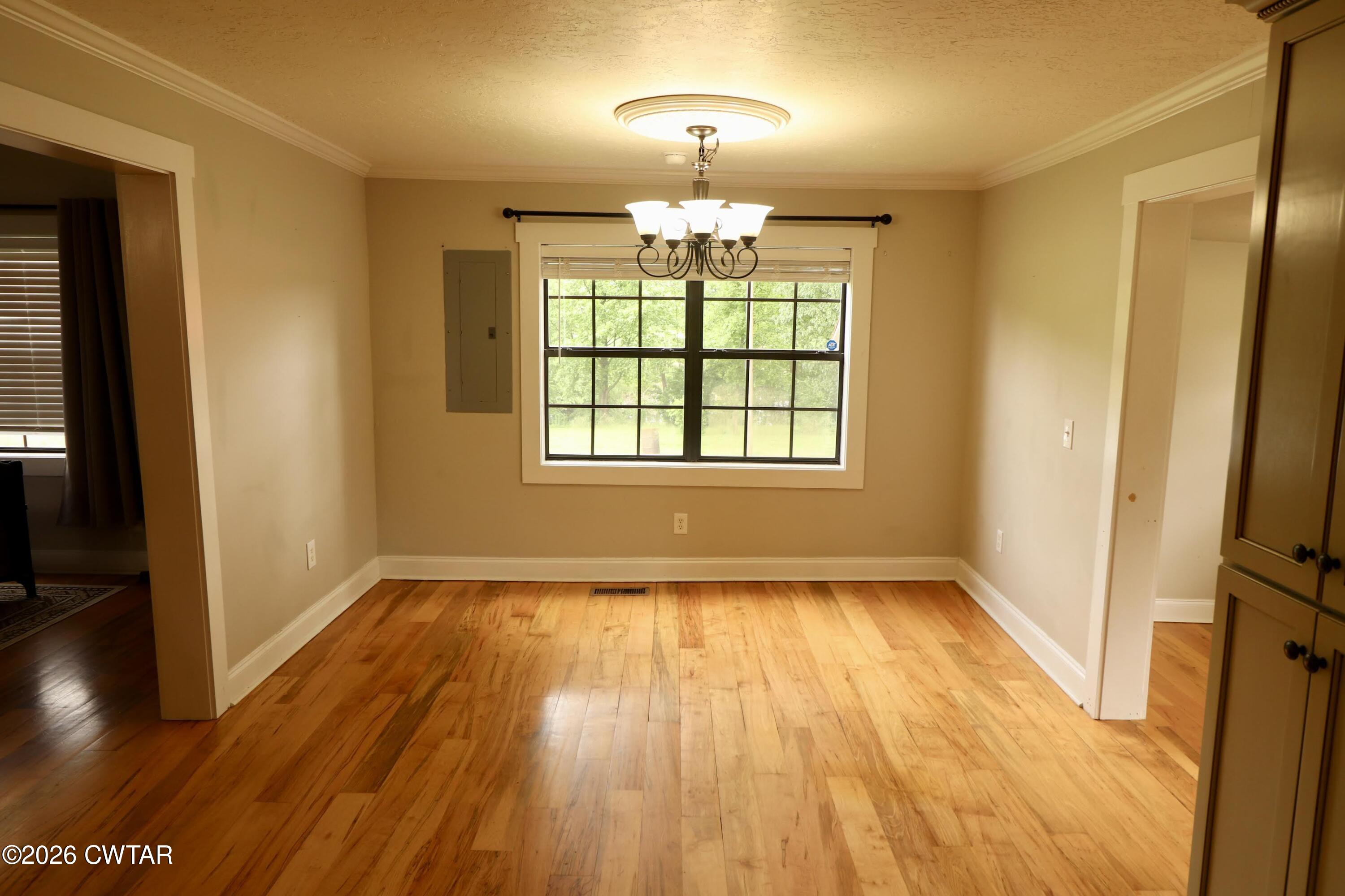 286 Baseline Road Kenton, TN 38233 - Photo 12 of 27 an empty room with wooden floor and windows