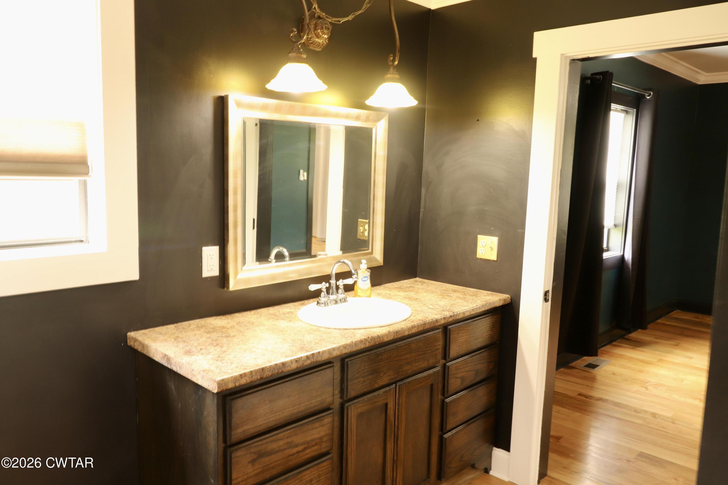 286 Baseline Road Kenton, TN 38233 - Photo 16 of 27 a bathroom with a sink and a mirror