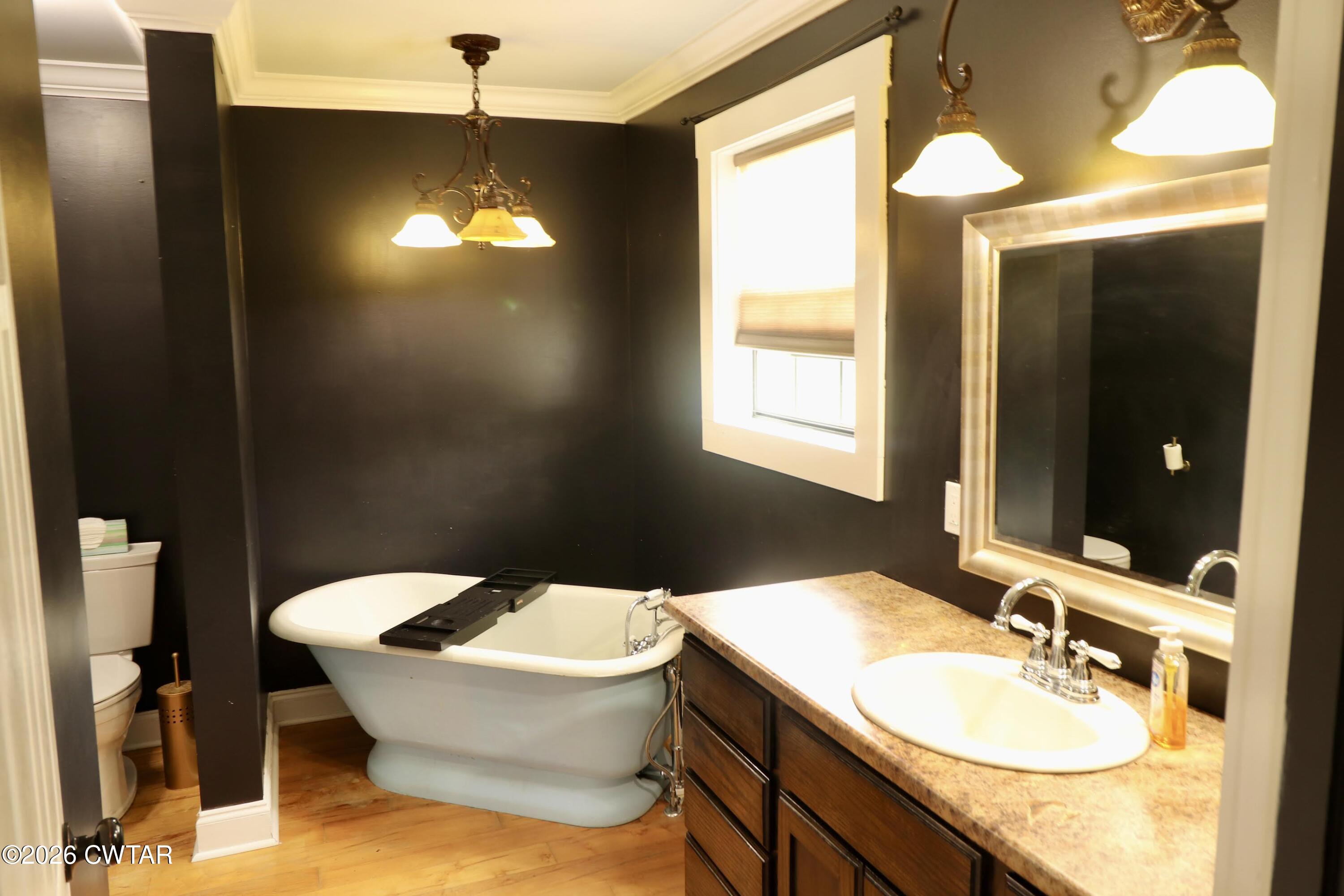 286 Baseline Road Kenton, TN 38233 - Photo 17 of 27 a bathroom with a toilet sink and mirror