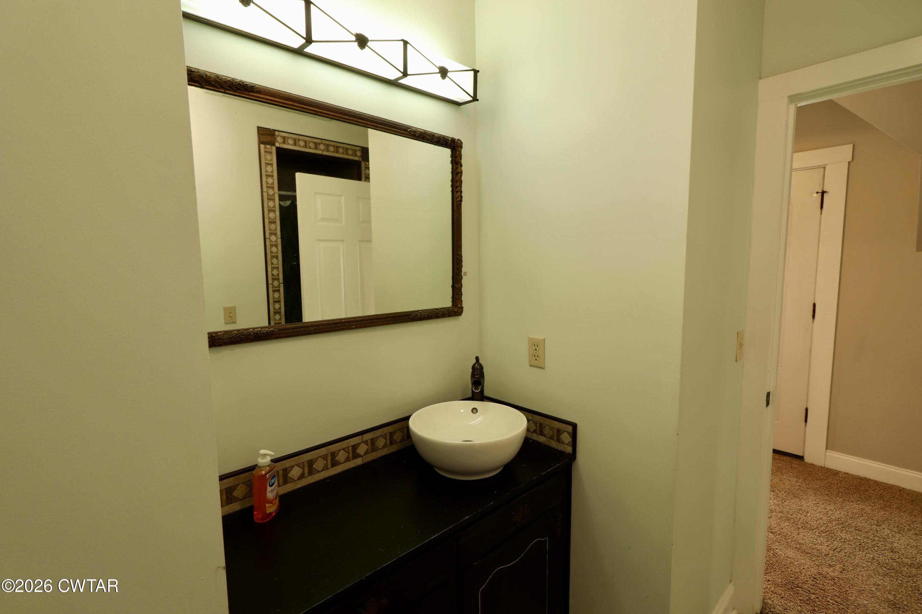 286 Baseline Road Kenton, TN 38233 - Photo 19 of 27 a bathroom with a sink and a mirror