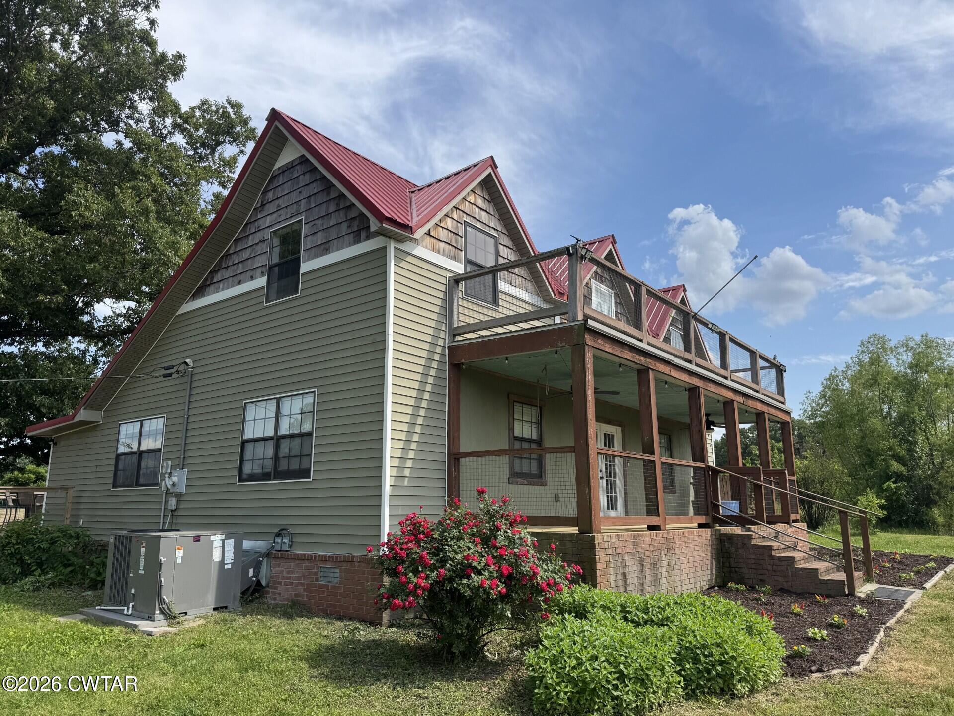 286 Baseline Road Kenton, TN 38233 - Photo 2 of 27 a view of house with a yard and potted plants