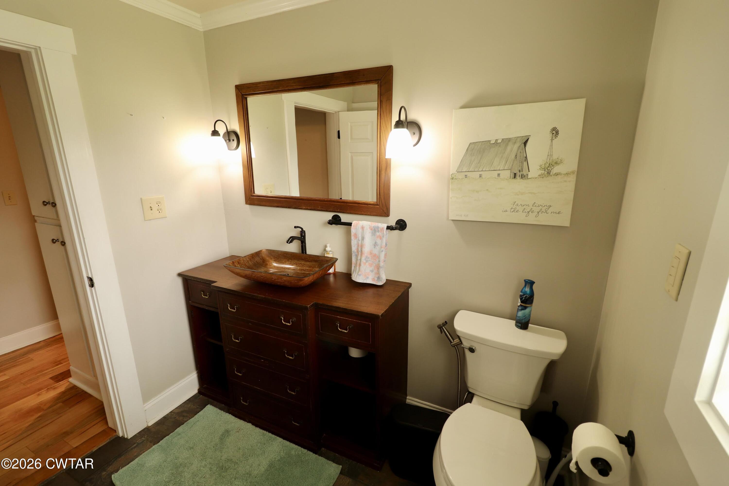 286 Baseline Road Kenton, TN 38233 - Photo 25 of 27 a bathroom with a toilet sink and mirror