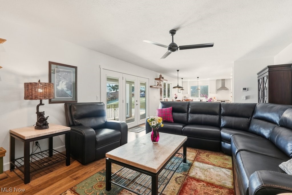 1430 Magnolia Road Southwest Dellroy, OH 44620 - Photo 10 of 50 Spacious living area with access to outdoor spaces, allowing for natural light and effortless indoor-outdoor flow.