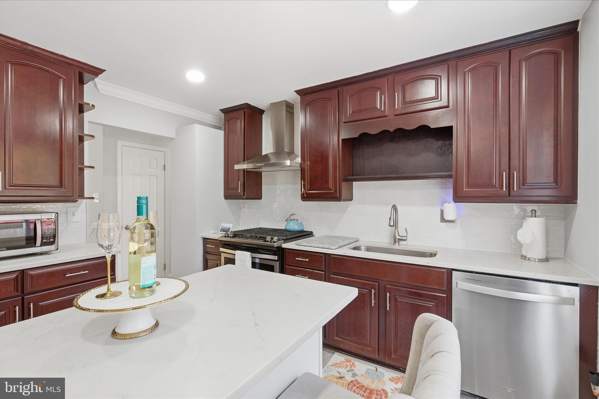 2816 Ridge Road Waldorf, MD 20603 - Photo 15 of 46 a kitchen with a sink stove and microwave