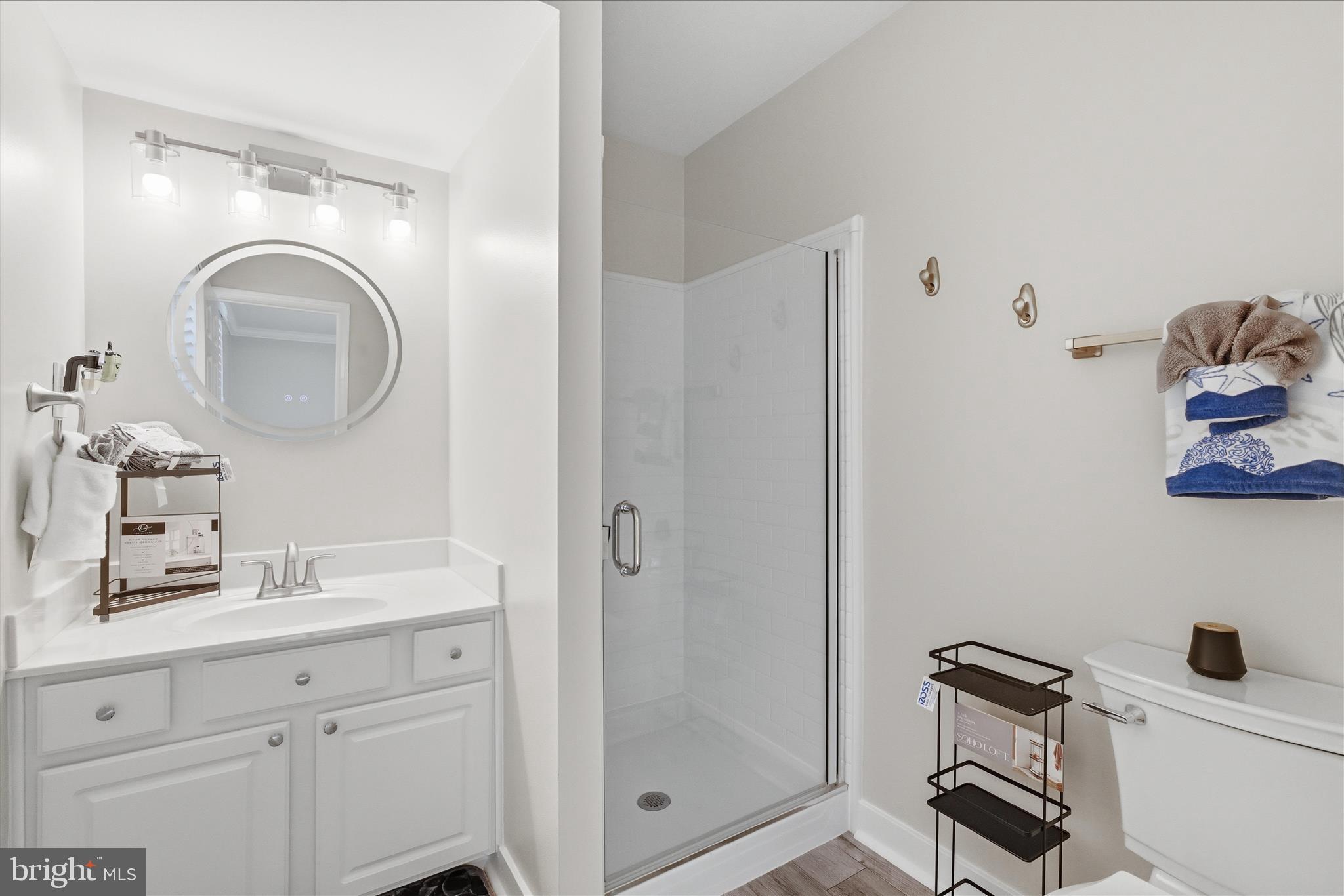 2816 Ridge Road Waldorf, MD 20603 - Photo 36 of 46 a bathroom with a granite countertop sink toilet and a mirror