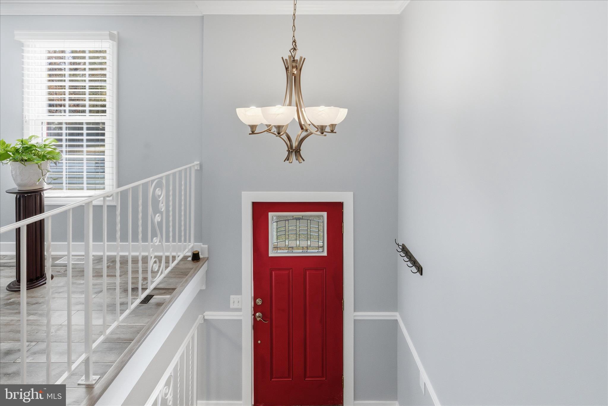 2816 Ridge Road Waldorf, MD 20603 - Photo 5 of 46 a view of a hallway with windows and chandelier
