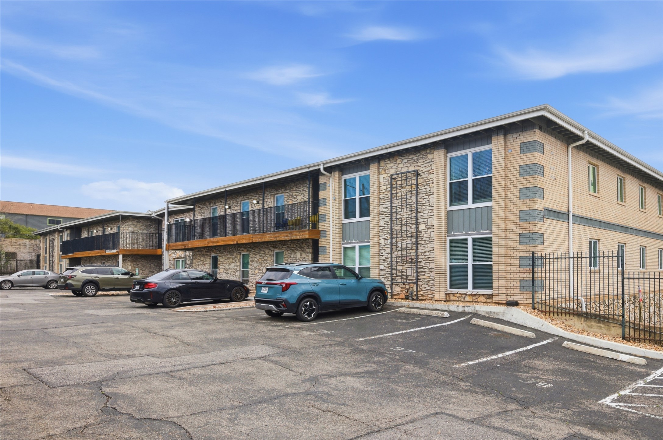 2401 Manor Road, Unit 232 Austin, TX 78722 - Photo 30 of 32 View of apartment building / complex featuring uncovered parking