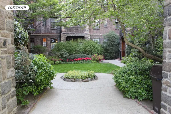 a view of a house with a yard and garden