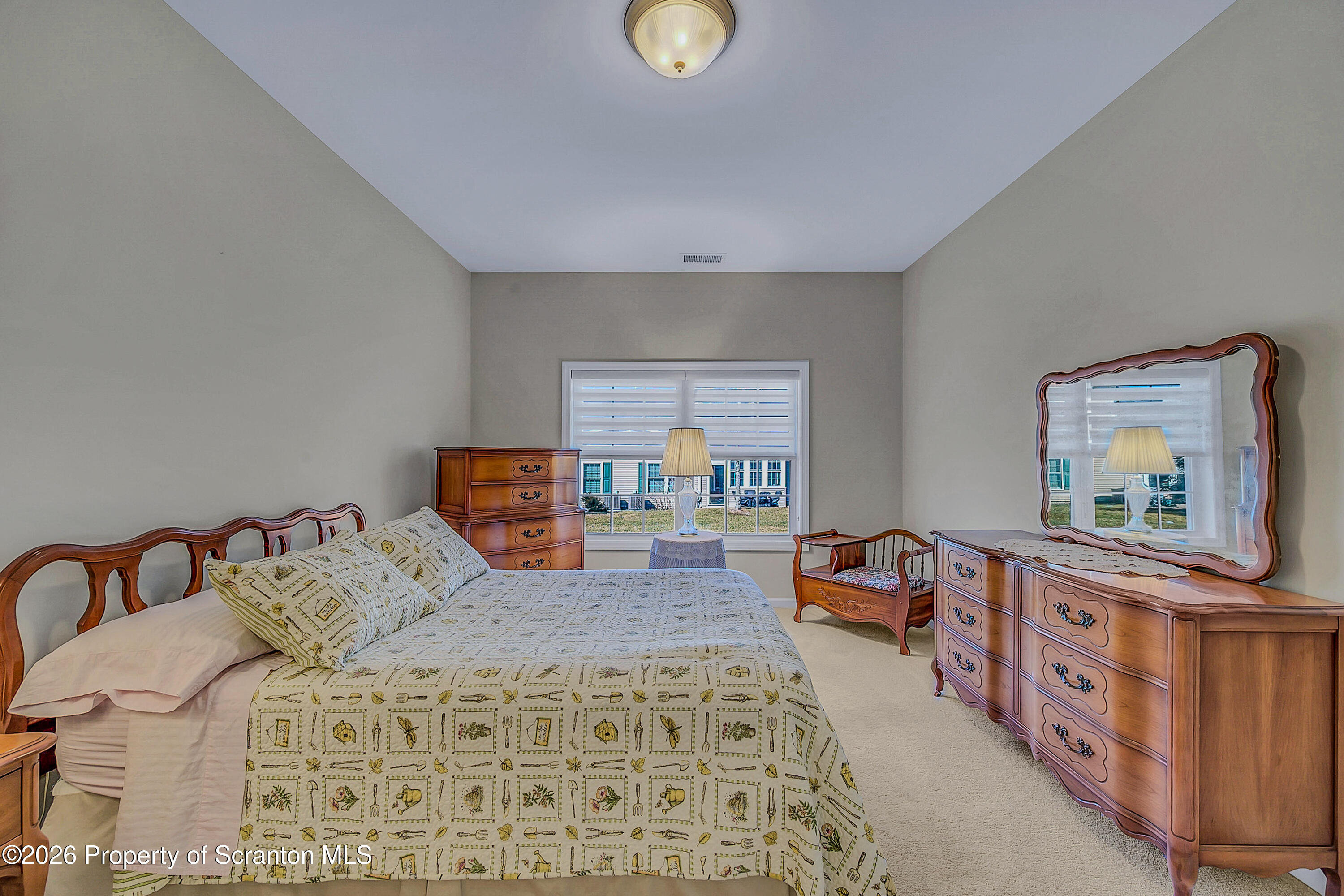 42 Wyndham Road Clarks Summit, PA 18411 - Photo 11 of 36 a bedroom with furniture and a dresser