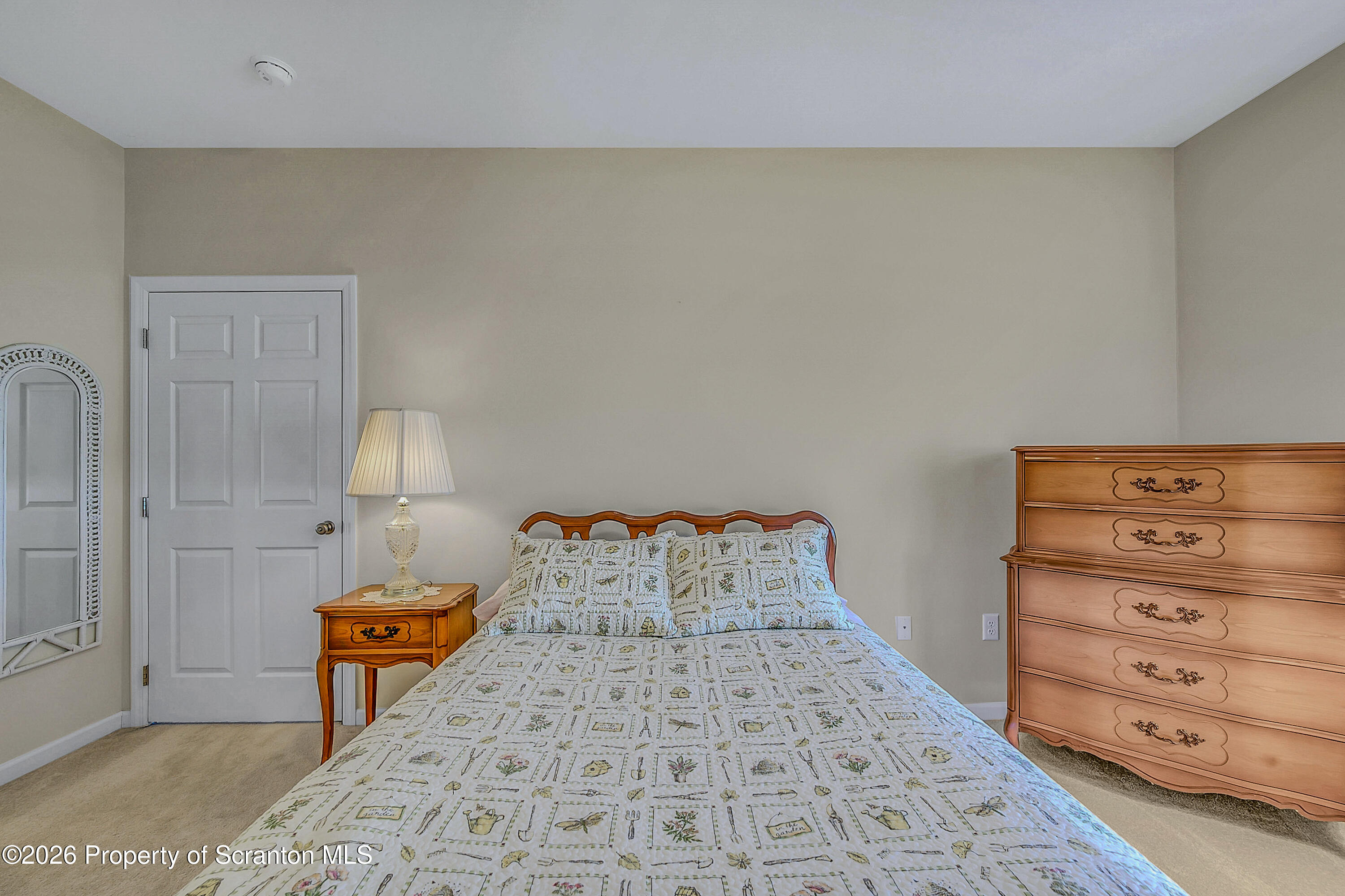 42 Wyndham Road Clarks Summit, PA 18411 - Photo 12 of 36 a bedroom with a bed and a night stand