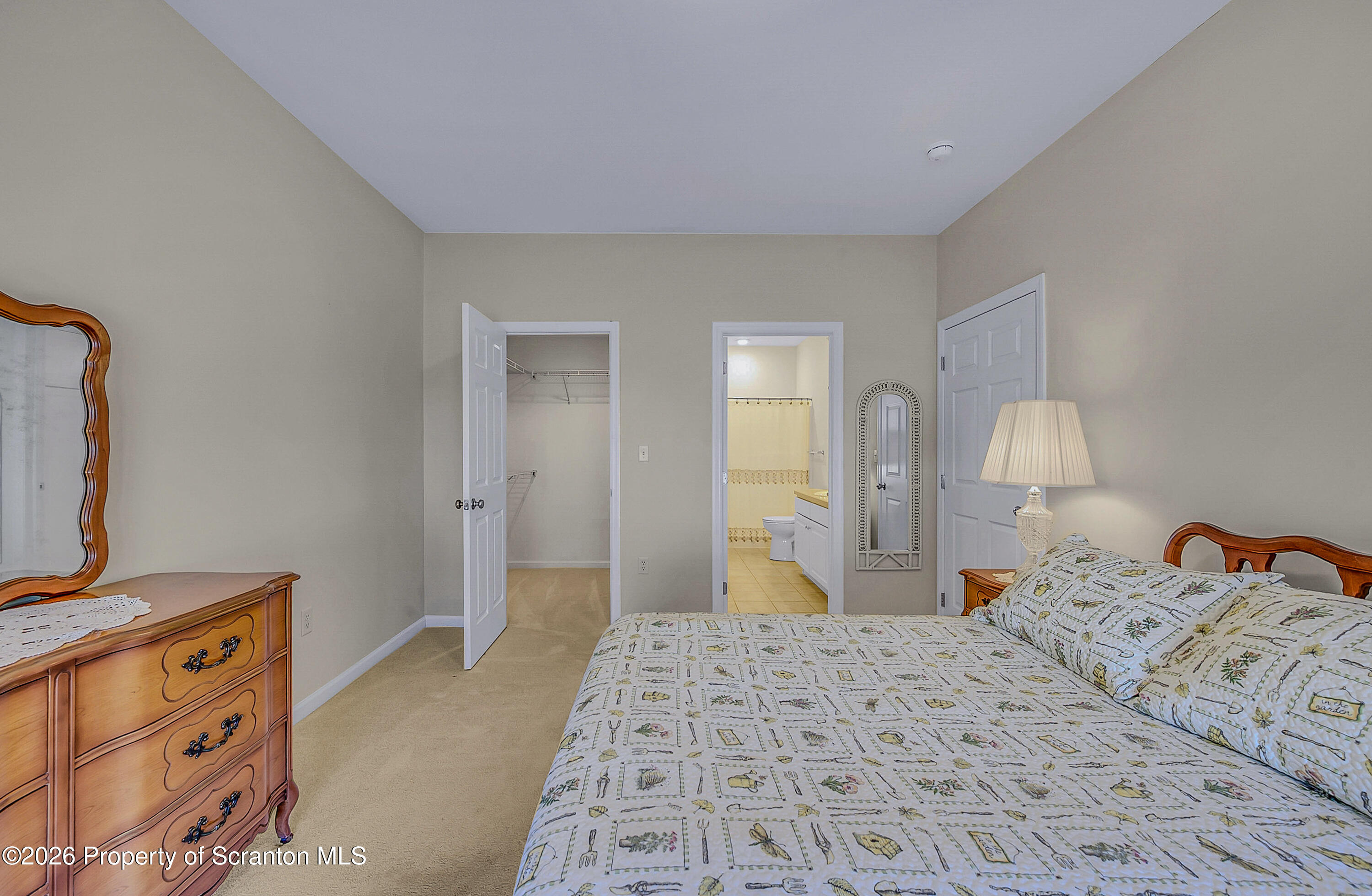 42 Wyndham Road Clarks Summit, PA 18411 - Photo 13 of 36 a bedroom with a bed and a flat tv screen on dresser