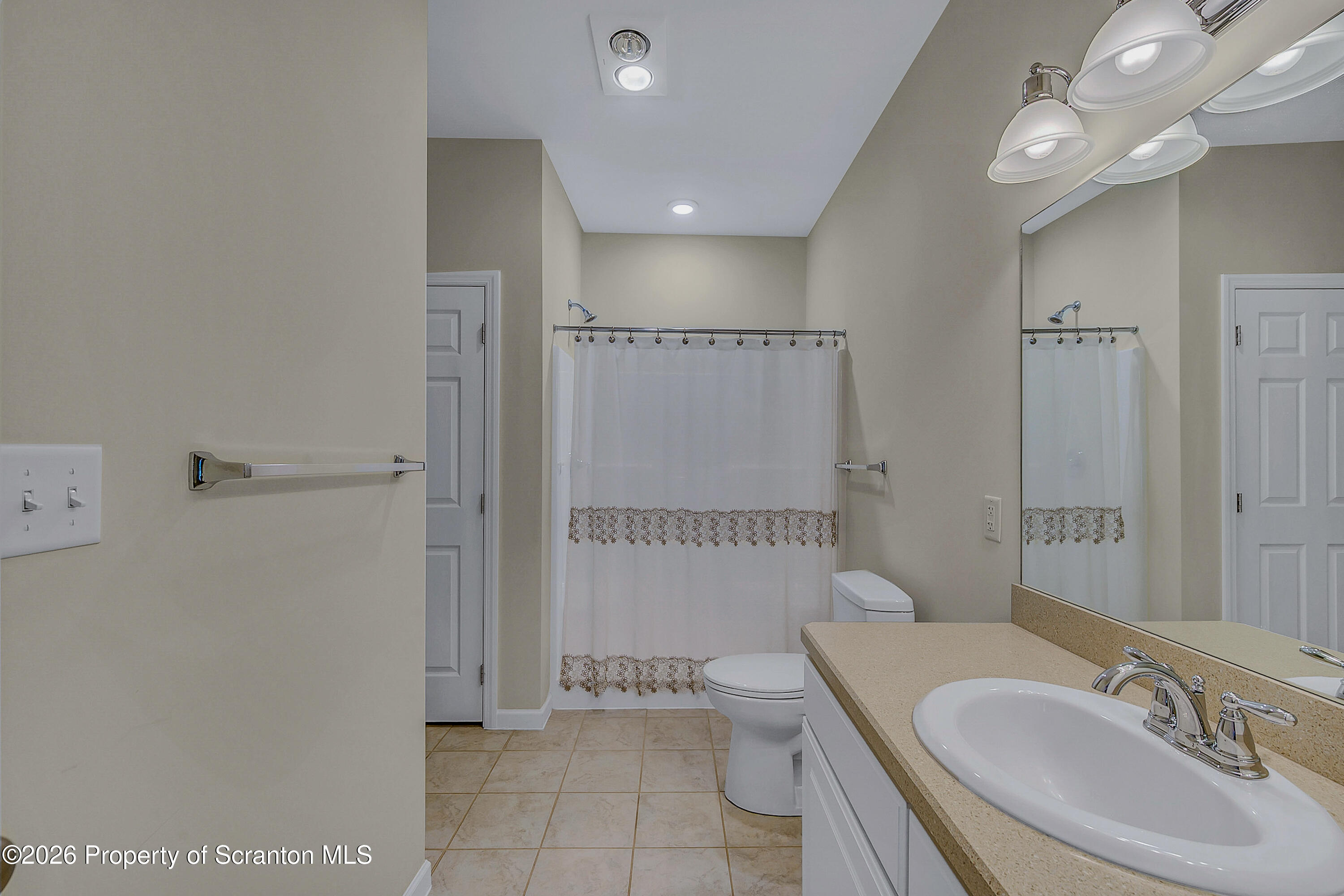 42 Wyndham Road Clarks Summit, PA 18411 - Photo 16 of 36 a bathroom with a sink a toilet and shower