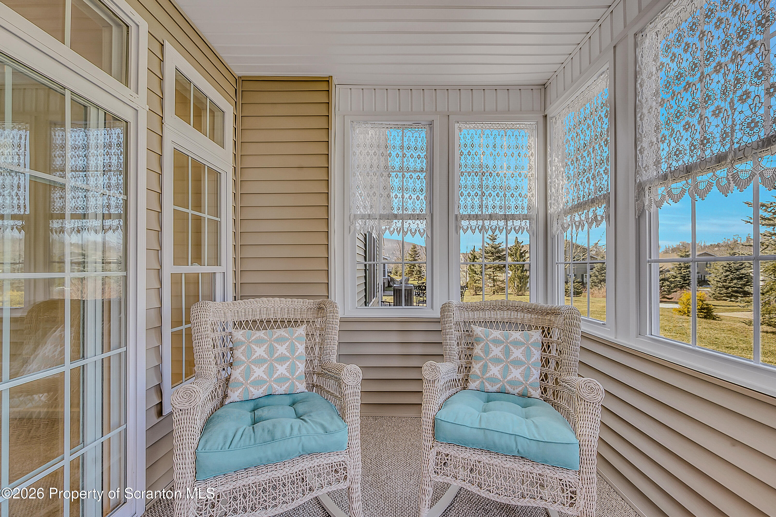 42 Wyndham Road Clarks Summit, PA 18411 - Photo 18 of 36 a view of a brick house with many windows